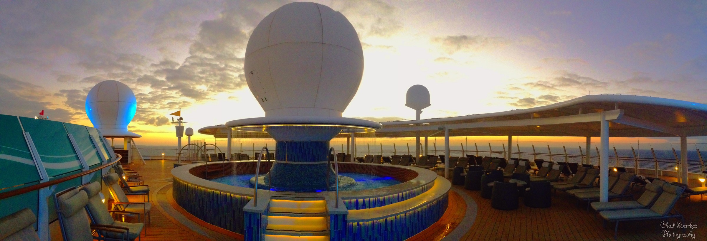 Satellite Falls adults-only pool area on Disney Fantasy at sunrise