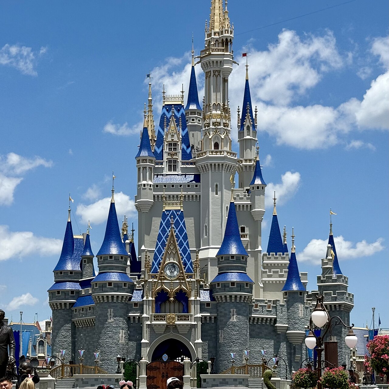 Cinderella Castle at Magic Kingdom with blue rooftops and pale stone towers